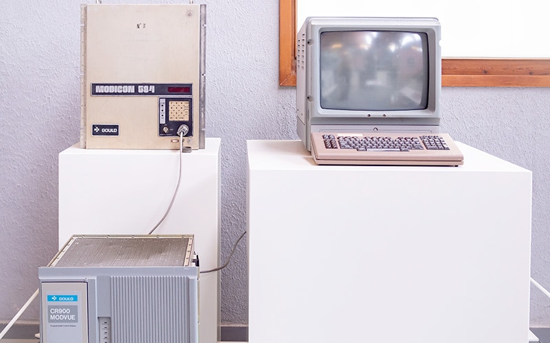 Programmable logic controller, the Modicon PLC 584, connected to an early PC as seen in the National Museum of Science and Technology of Catalonia, Spain