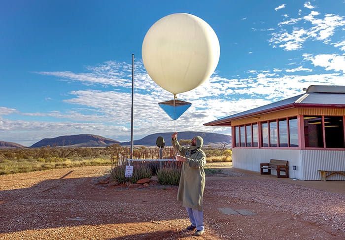 Giles, Western Australia - August 19, 2010:Launching the balloon at Australia's most remote weather station. Giles Weather Station, located in Western Australia near the Northern Territory border